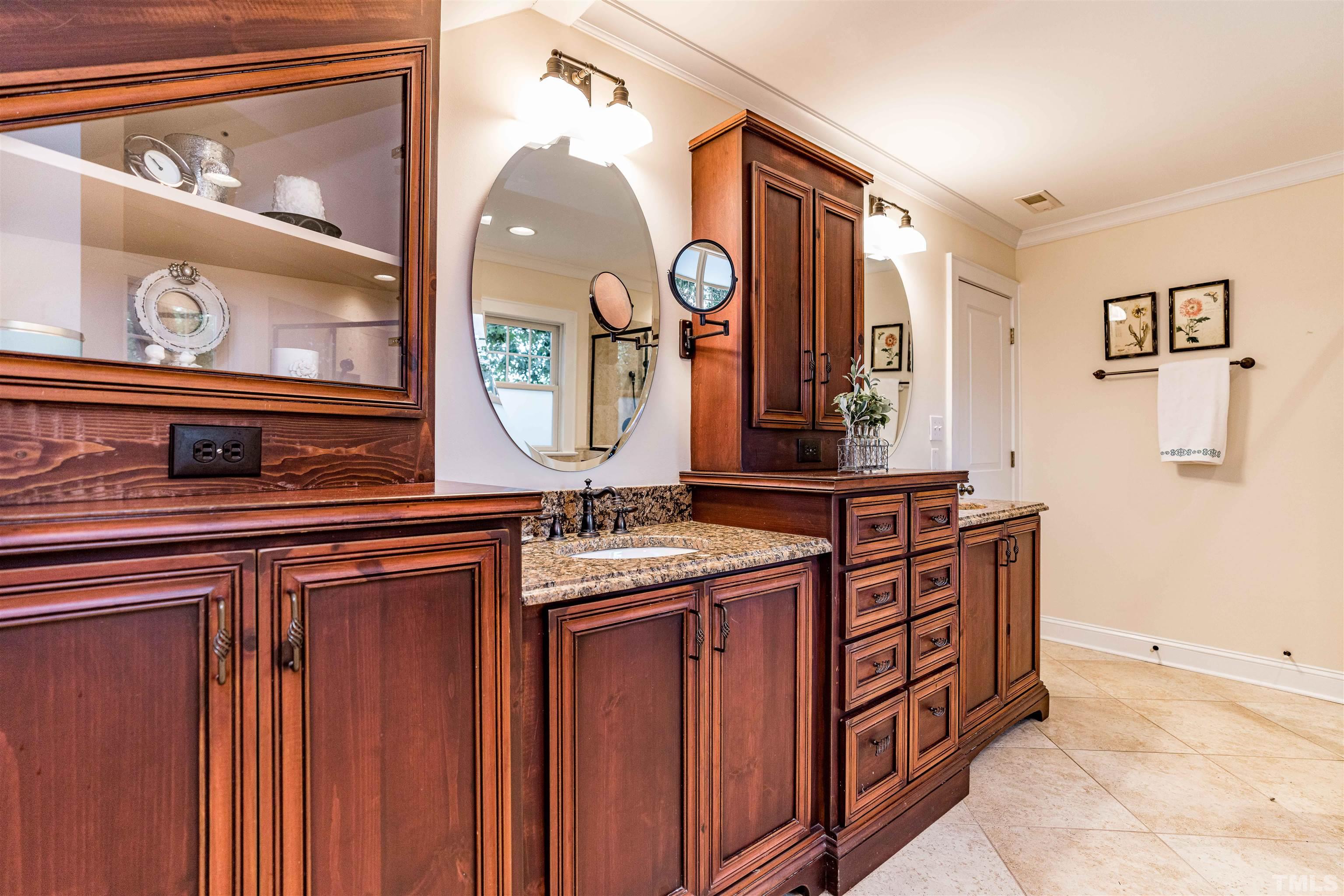 2706 Barmettler Street Raleigh, NC 27607 - Photo 34 of 43 a bathroom with a sink and a mirror