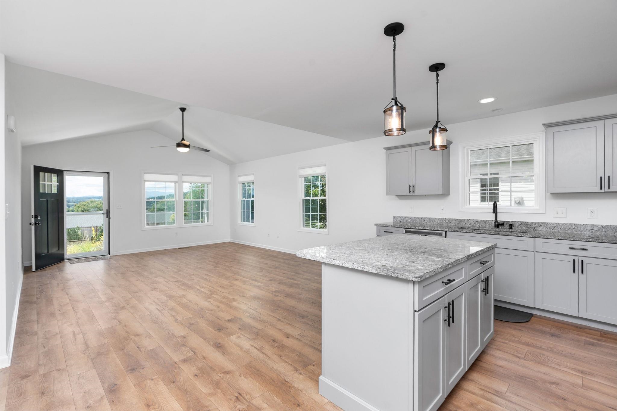 307 Kaolin Spring Lane Greenville, VA 24440 - Photo 5 of 7 a kitchen with a sink stove and cabinets