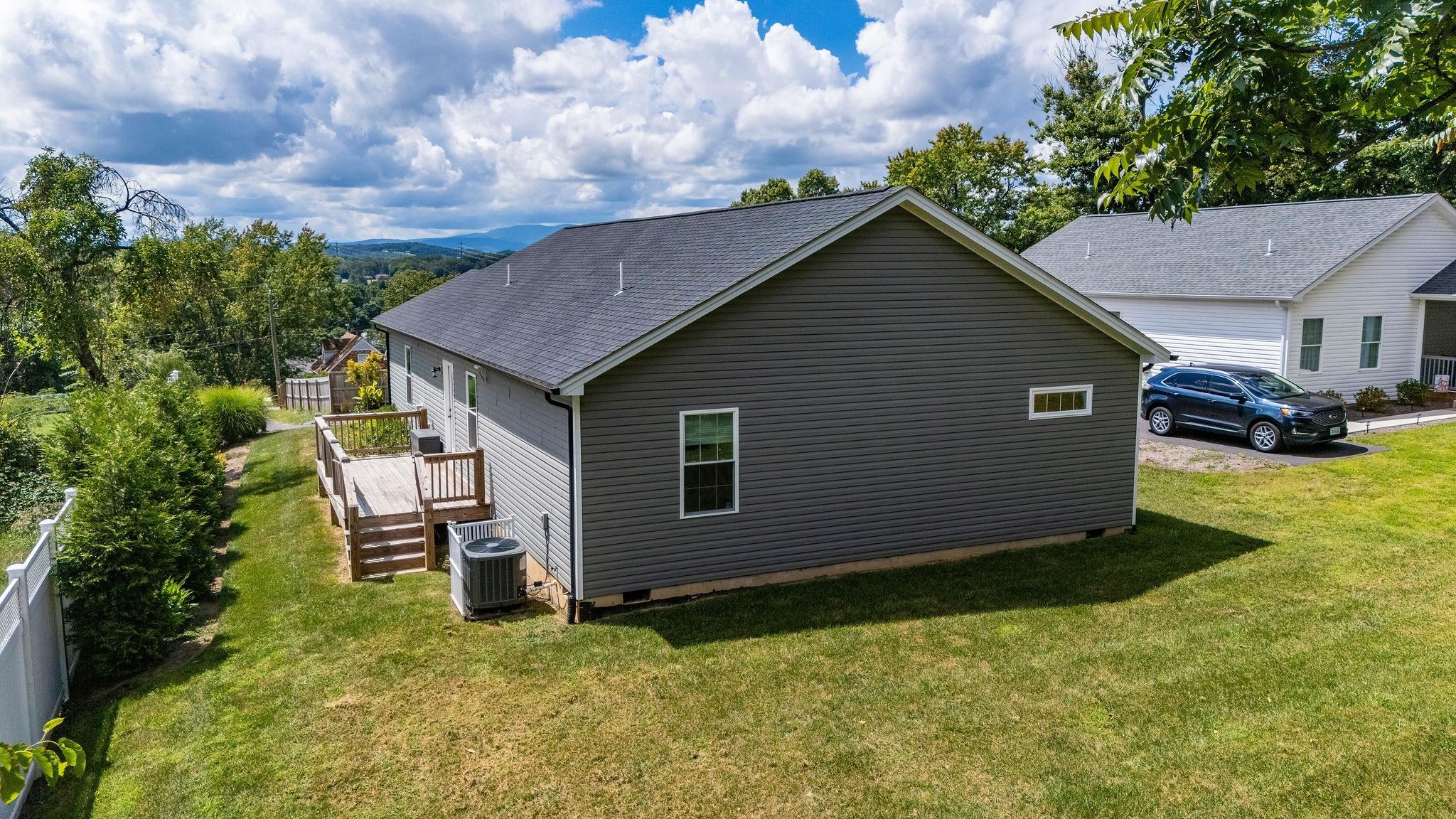 307 Kaolin Spring Lane Greenville, VA 24440 - Photo 7 of 7 a backyard of a house with table and chairs