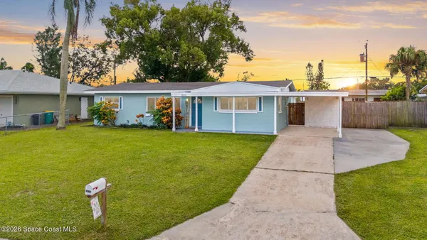 a house view with a garden space