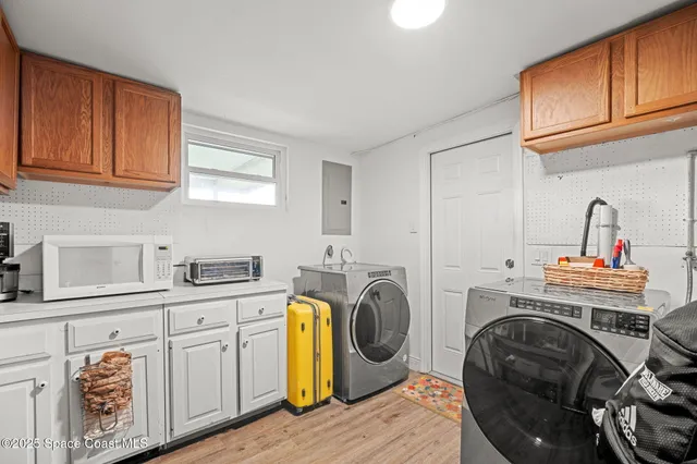 a kitchen with stainless steel appliances a refrigerator and a stove top oven