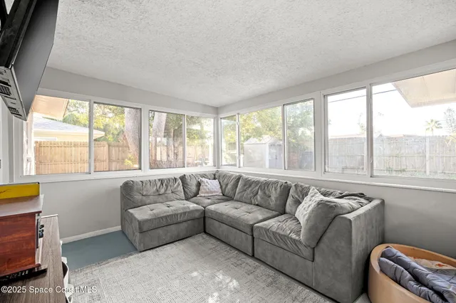 a view of a workspace with furniture and a couch