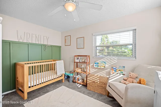 a view of livingroom with furniture and workspace