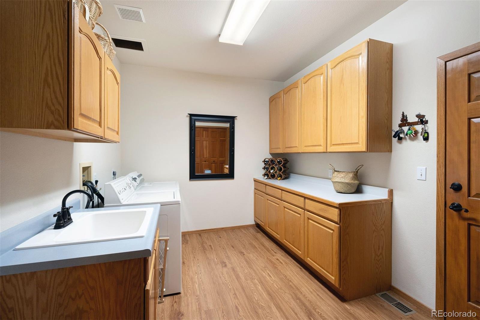 4275 Stonecliff Drive Evergreen, CO 80439 - Photo 23 of 48 a kitchen with a sink and cabinets