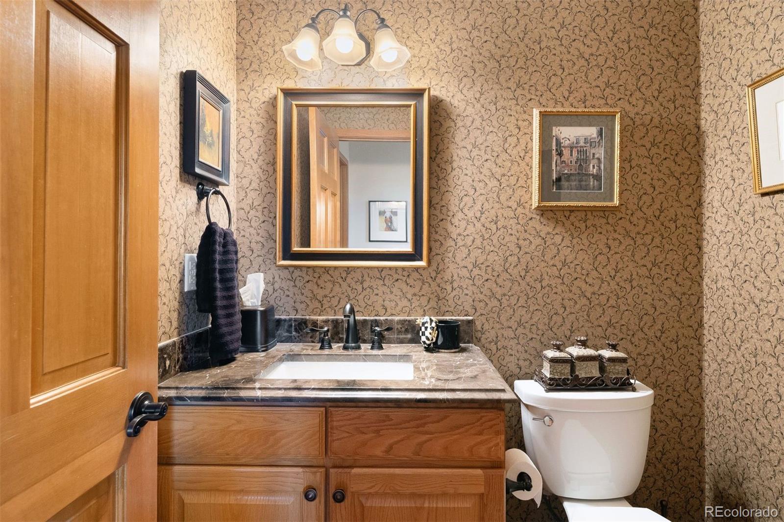 4275 Stonecliff Drive Evergreen, CO 80439 - Photo 24 of 48 a bathroom with a sink and a mirror