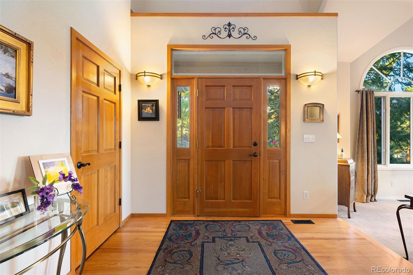 4275 Stonecliff Drive Evergreen, CO 80439 - Photo 7 of 48 a view of an entryway with wooden floor
