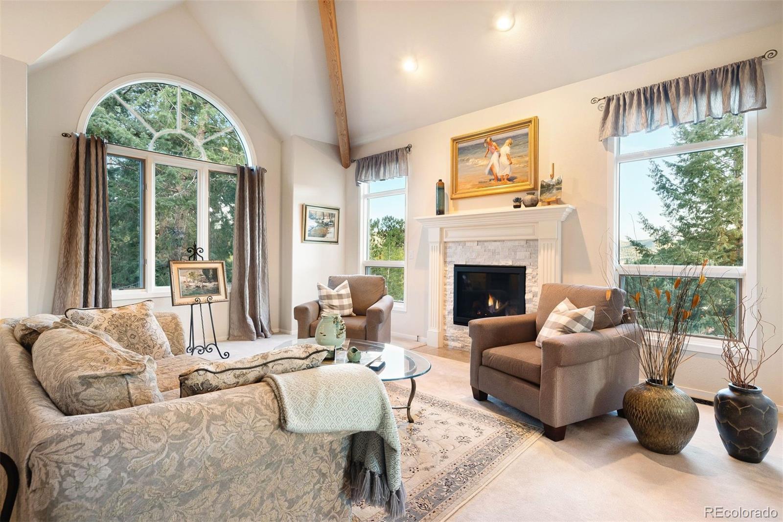 4275 Stonecliff Drive Evergreen, CO 80439 - Photo 10 of 48 a living room with furniture and a large window