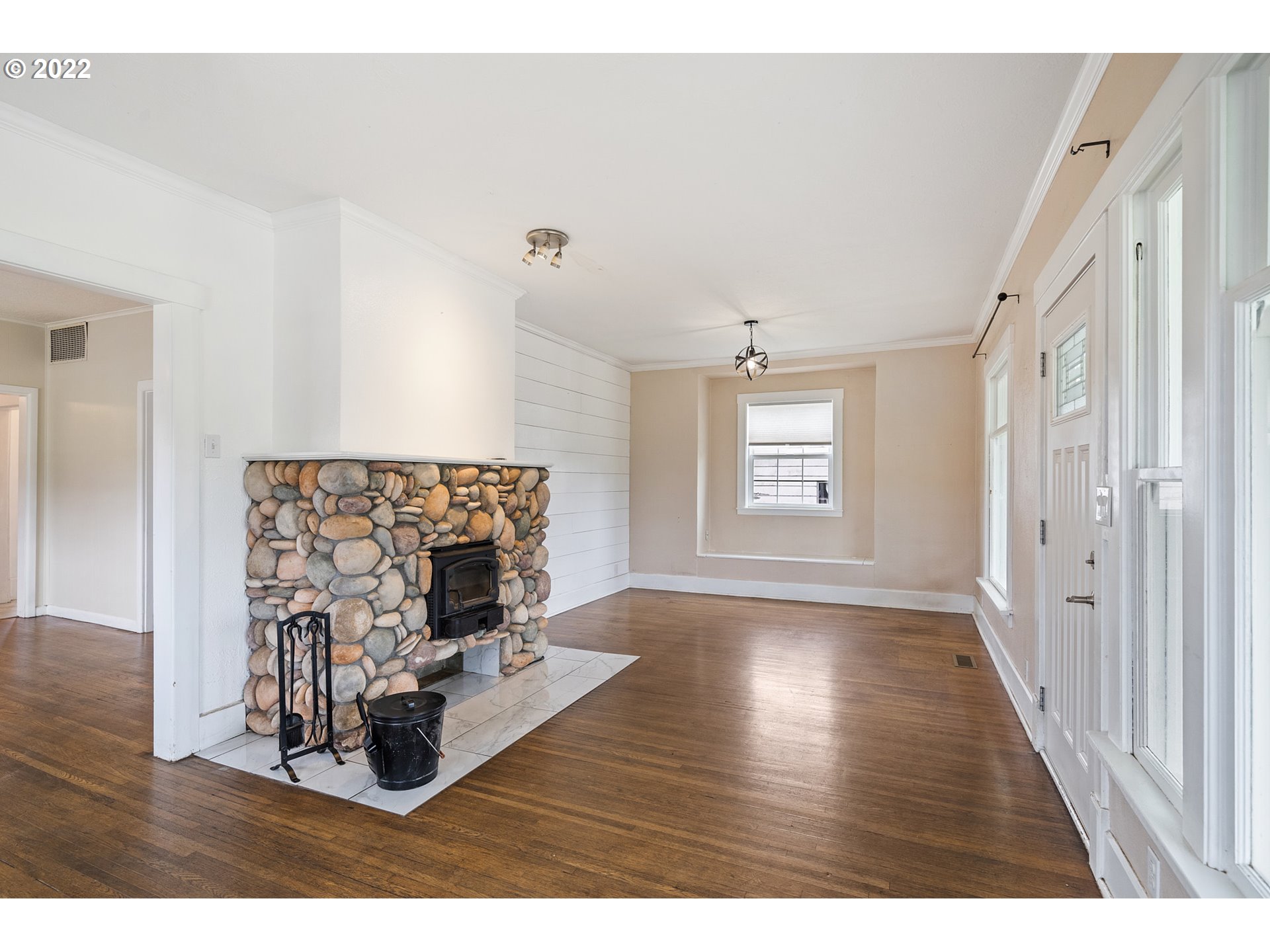 1802 8th Street Tillamook, OR 97141 - Photo 3 of 13 a living room with furniture and a fireplace