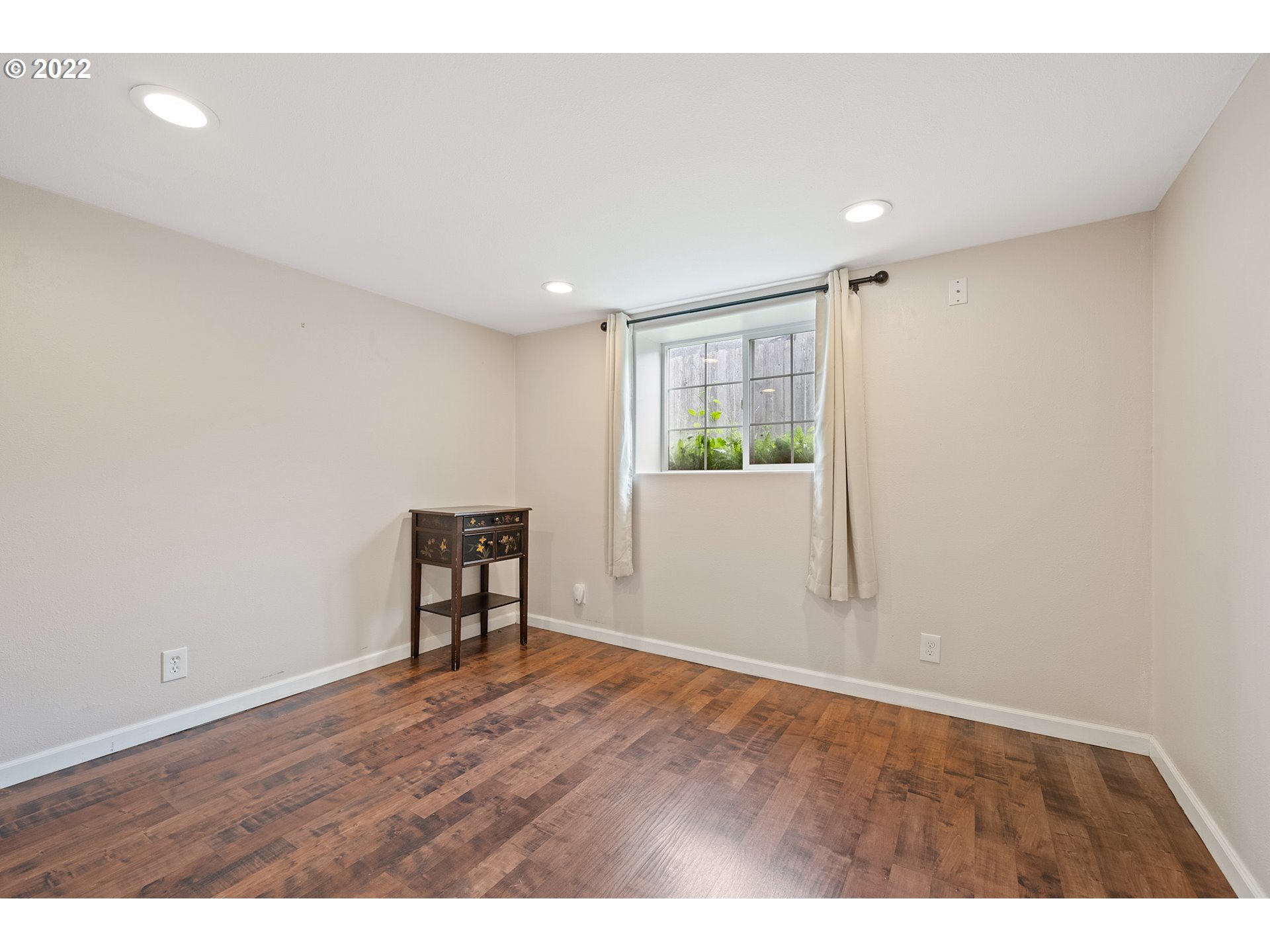 1802 8th Street Tillamook, OR 97141 - Photo 10 of 13 a view of an empty room with wooden floor and a window