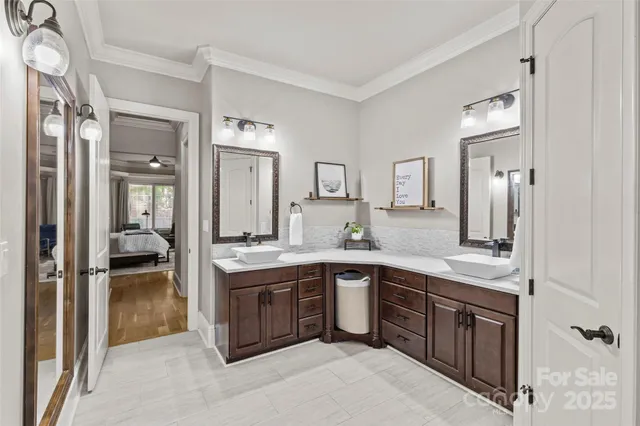 a bathroom with a tub a window and a shower