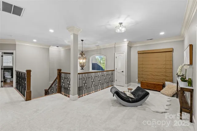 a view of a hallway with a livingroom and a fireplace