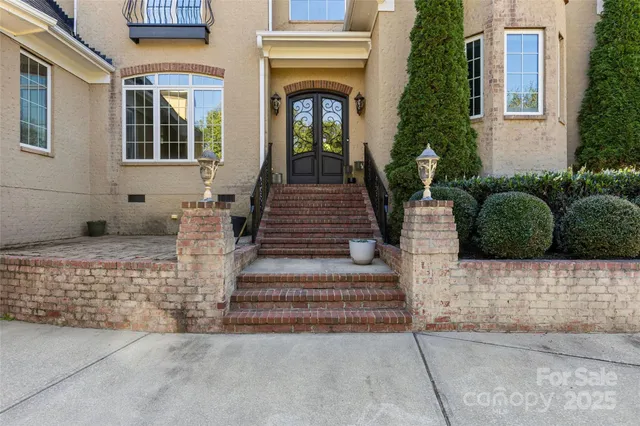 a front view of a house with potted plants