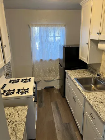 a kitchen with a stove and a sink