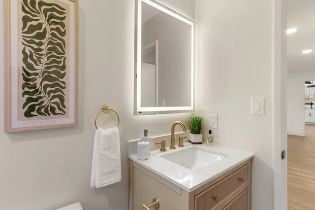 a bathroom with a sink and a mirror
