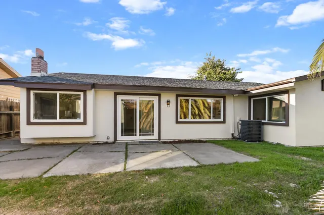 a house with sign broad in front of it