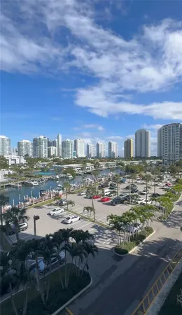 an aerial view of a residential building and street view
