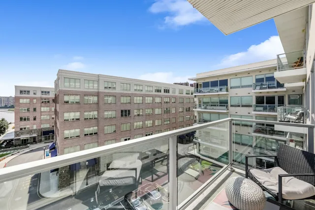 a view of a balcony with chairs