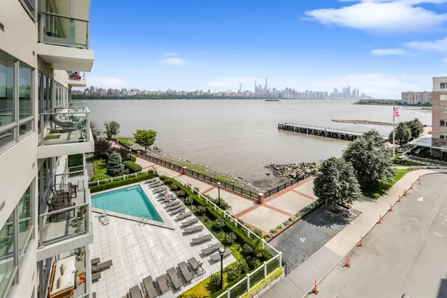 a view of a swimming pool with an ocean view