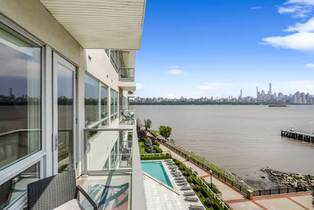 a balcony with wooden floor and outdoor space
