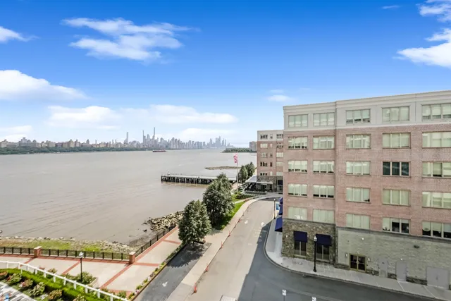 a view of a city with a lake