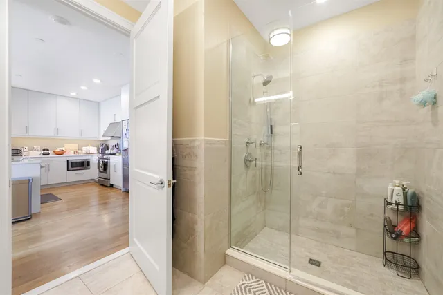 a bathroom with a tub and shower