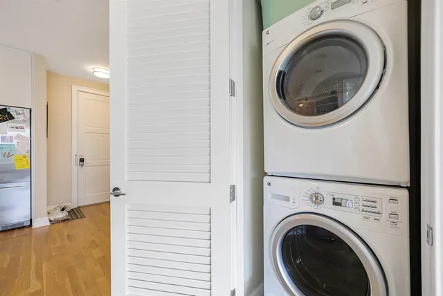 a view of a hallway with washer and dryer