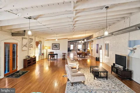 a view of livingroom with window and wooden floor