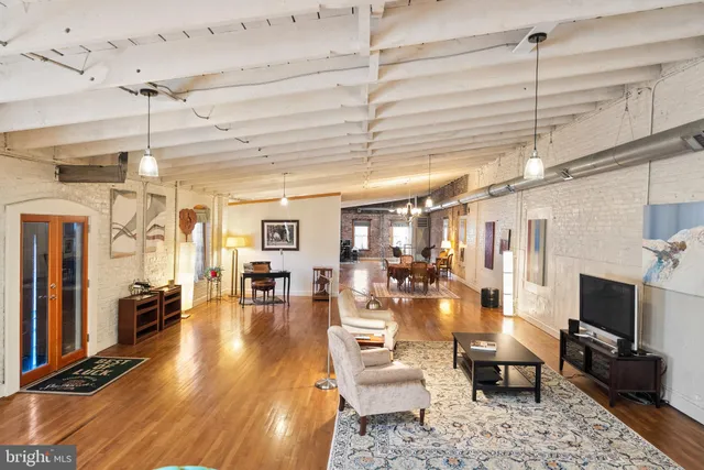 a view of livingroom with window and wooden floor