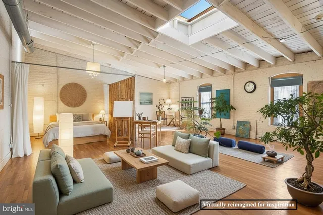 a living room with lots of furniture and a fireplace