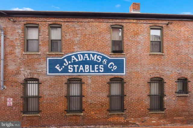 a view of a house with a chairs in patio