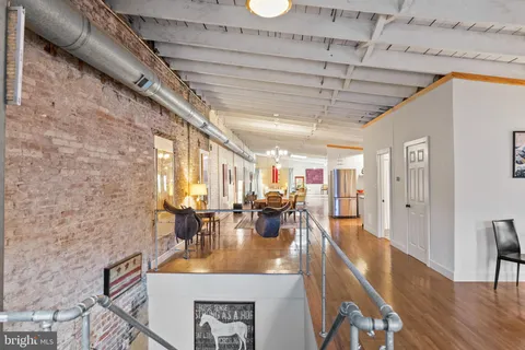a room with furniture pool table and flat screen tv