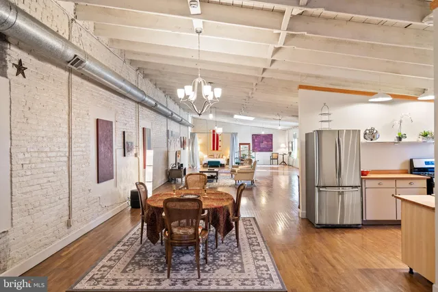 a dining room with furniture and a window