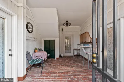 a view of balcony with furniture