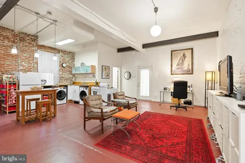 a view of a gym equipment and kitchen appliances