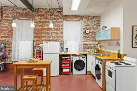 a view of a brick building with many windows