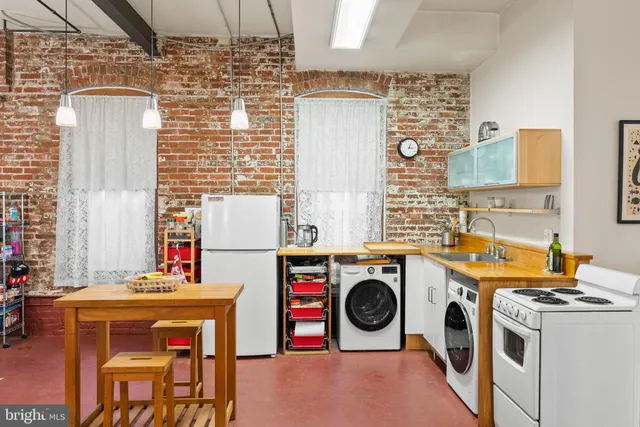 a view of a brick building with many windows