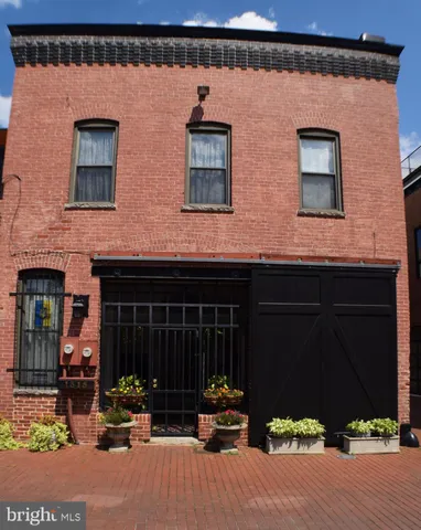 a lobby with furniture and floor to ceiling window