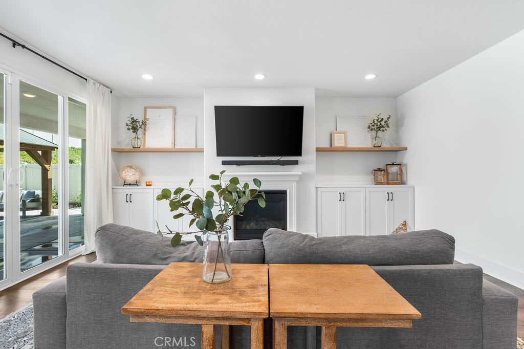 32166 Verbena Way Temecula, CA 92591 - Photo 12 of 47 a living room with furniture potted plant and a flat screen tv