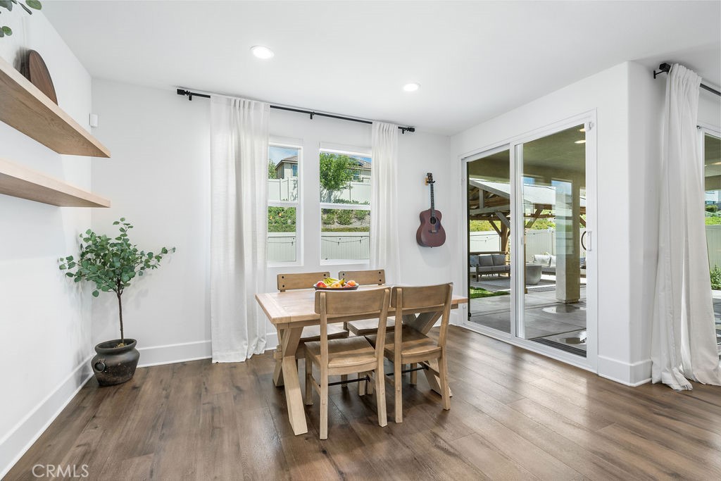 32166 Verbena Way Temecula, CA 92591 - Photo 15 of 47 a view of a dining room with furniture window and wooden floor