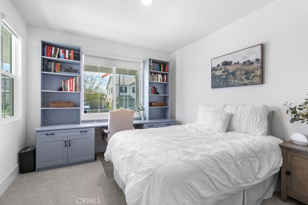 32166 Verbena Way Temecula, CA 92591 - Photo 16 of 47 a bedroom with a large bed and a window