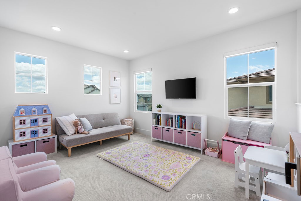 32166 Verbena Way Temecula, CA 92591 - Photo 20 of 47 a living room with furniture and a flat screen tv
