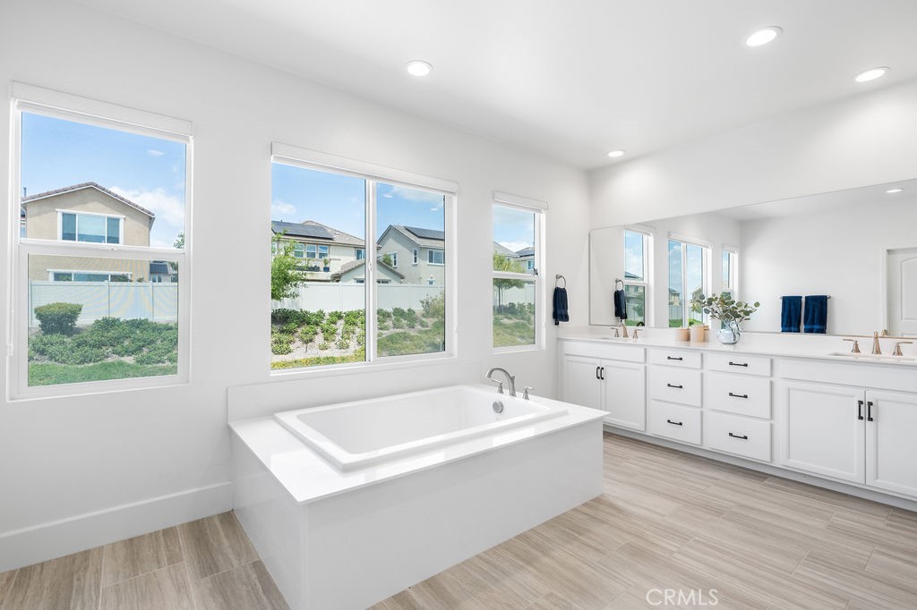 32166 Verbena Way Temecula, CA 92591 - Photo 24 of 47 a large white kitchen with a large window