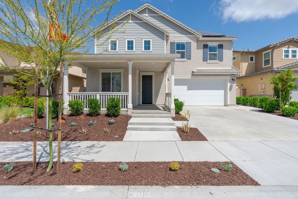 32166 Verbena Way Temecula, CA 92591 - Photo 3 of 47 a front view of a house with garden