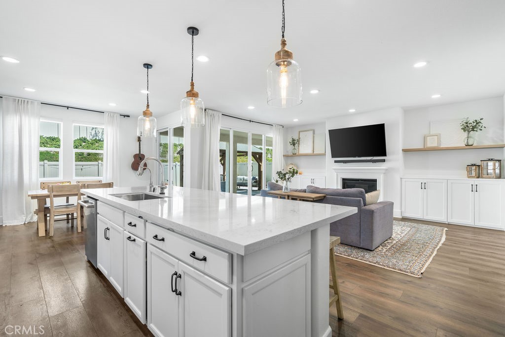 32166 Verbena Way Temecula, CA 92591 - Photo 10 of 47 a kitchen with center island table and chairs