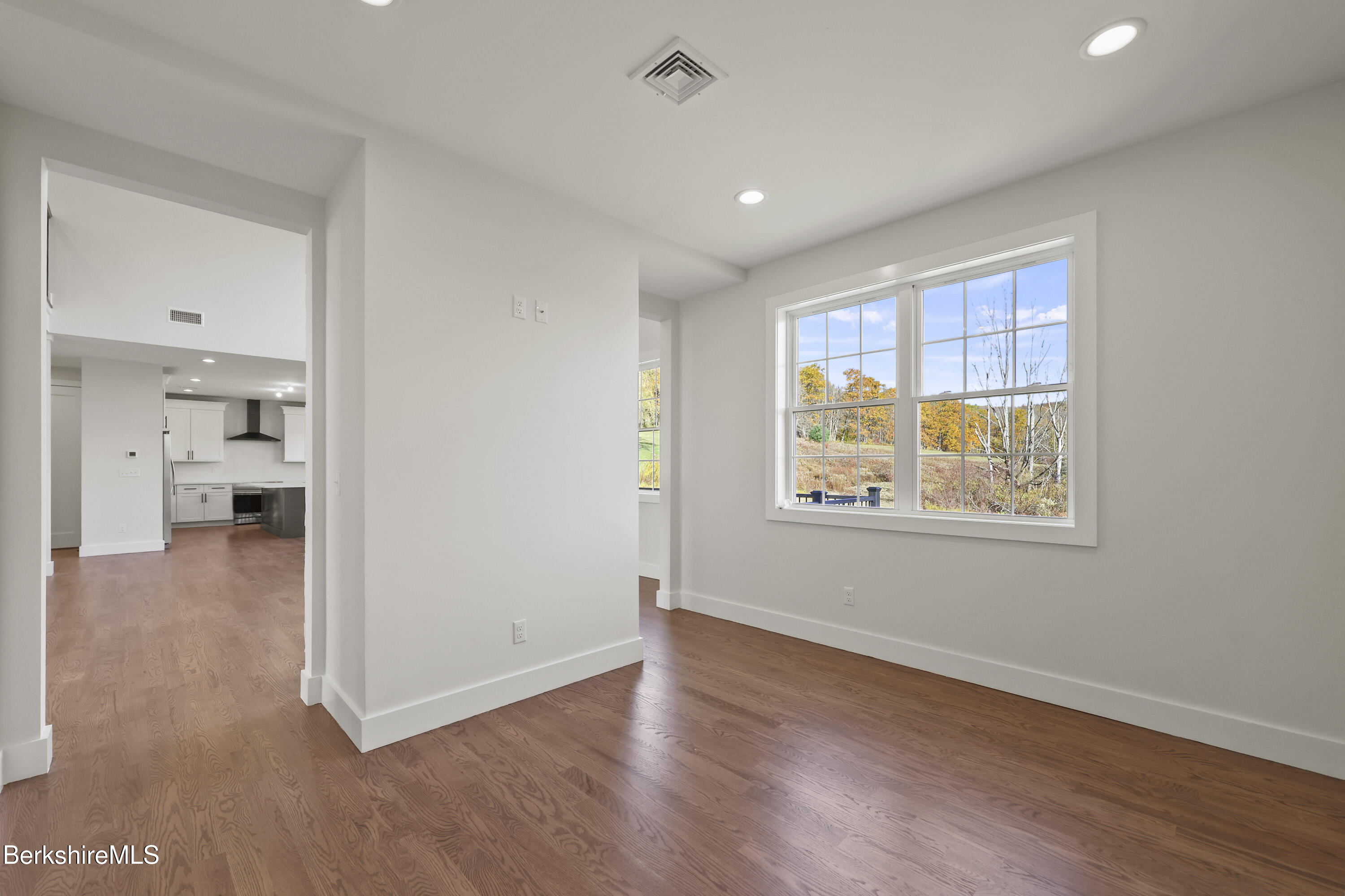 8 Northbrook Lane Pittsfield, MA 01201 - Photo 25 of 90 a view of livingroom with hardwood floor and a kitchen