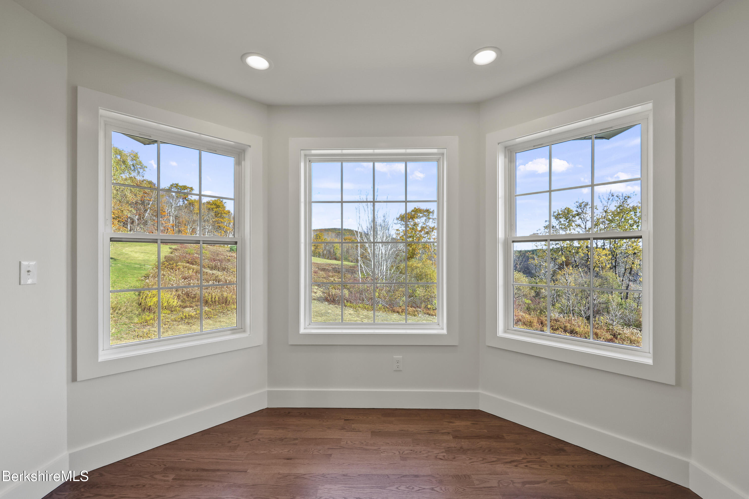8 Northbrook Lane Pittsfield, MA 01201 - Photo 50 of 90 a view of an empty room with wooden floor and a window
