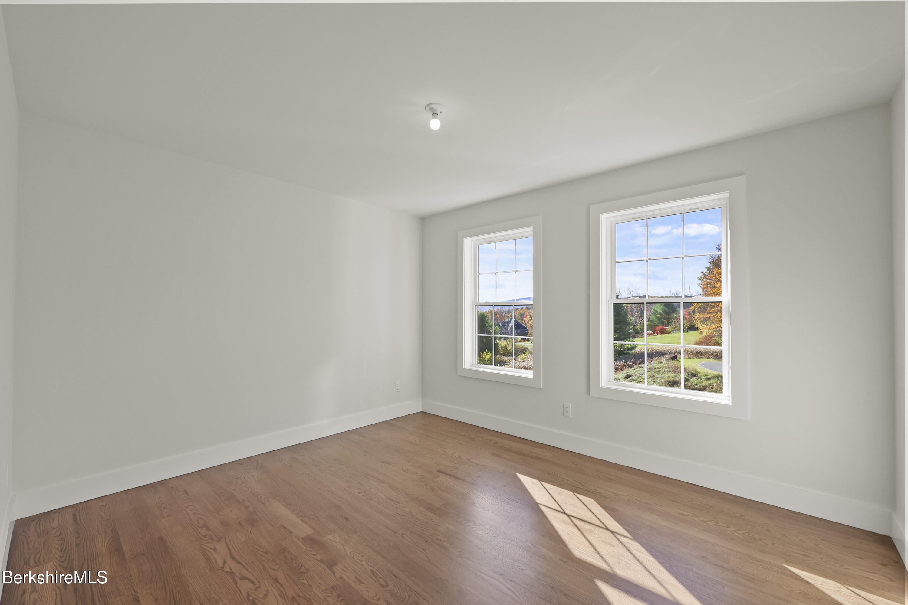 8 Northbrook Lane Pittsfield, MA 01201 - Photo 60 of 90 an empty room with wooden floor and windows