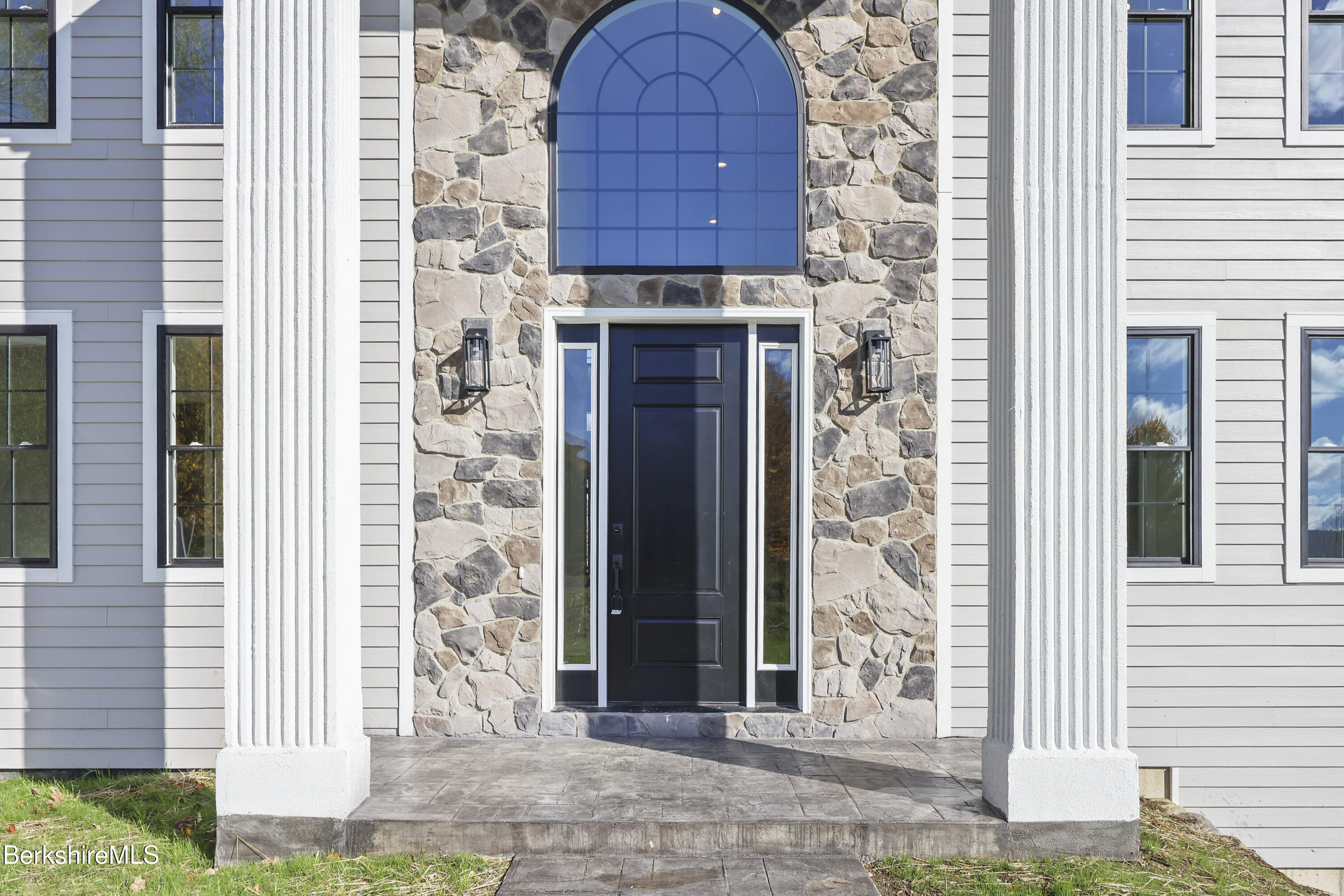 8 Northbrook Lane Pittsfield, MA 01201 - Photo 6 of 90 a view of a wooden door with a small yard