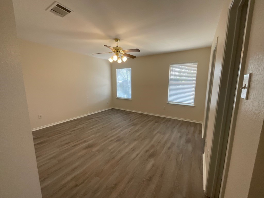 169 Spring Branch Loop Kyle, TX 78640 - Photo 4 of 13 Primary bedroom overlooking the back yard