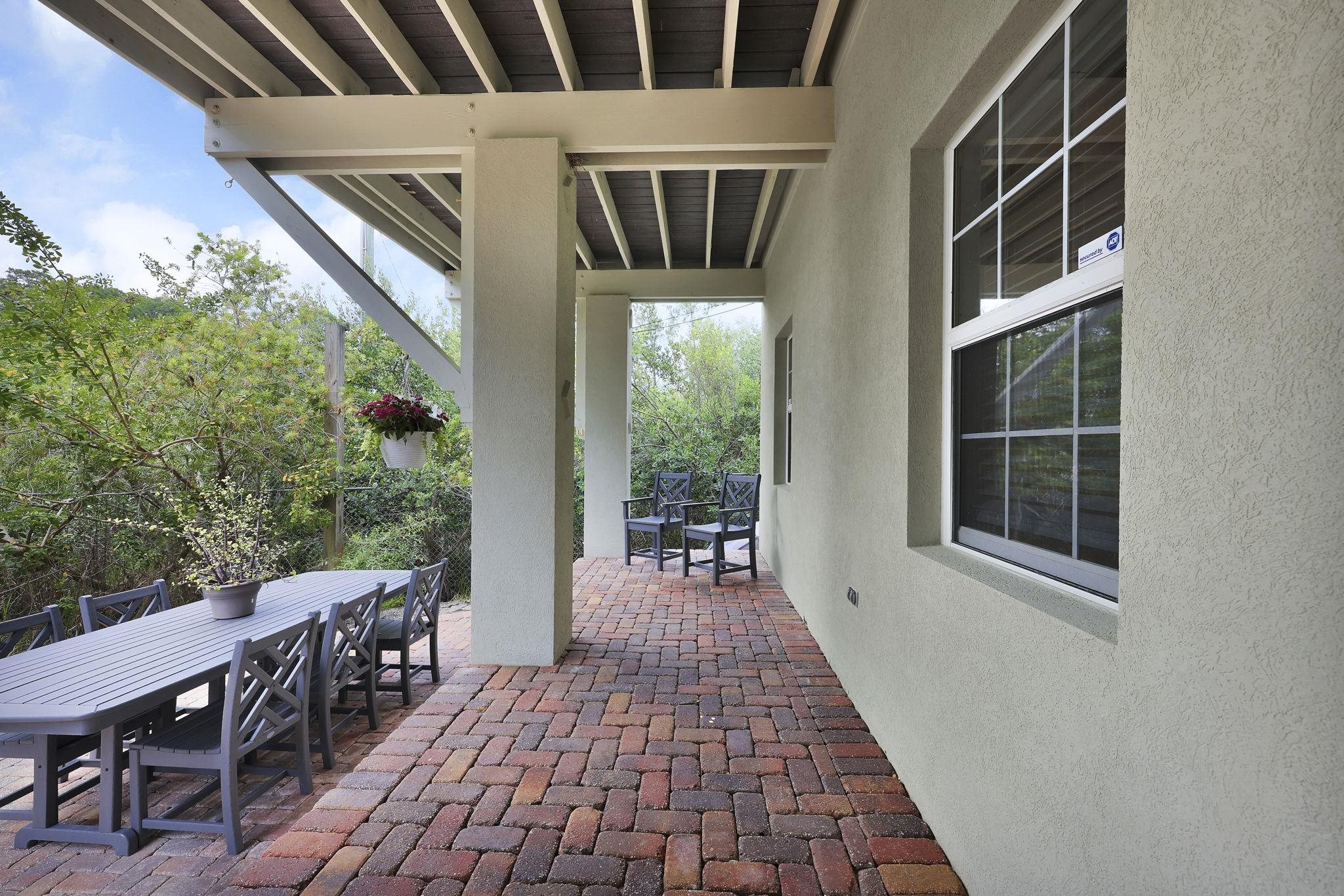 311 Weff Road St. Augustine, FL 32080 - Photo 31 of 65 a view of balcony with wooden floor and seating space